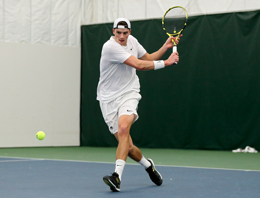 Iowa’s Joe Tyler returns a shot during his singles match at the Hawkeye Tennis and Recreation Complex in Iowa City on Sunday, February 16, 2020. (Stephen Mally/hawkeyesports.com)