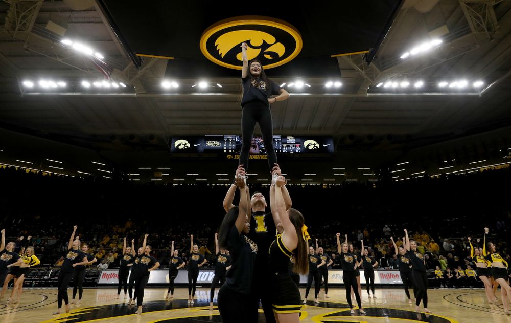 The Iowa Spirit Squad performs with participants in Spirit Squad Day at halftime of the Iowa Hawkeyes game against the Nebraska Cornhuskers Saturday, February 8, 2020 at Carver-Hawkeye Arena. (Brian Ray/hawkeyesports.com)