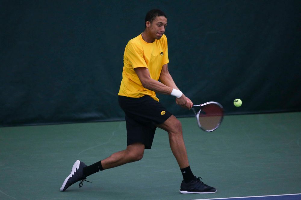 Iowa's Oliver Okonkwo at a tennis match vs Drake Friday, March 8, 2019 at the Hawkeye Tennis and Recreation Complex. (Lily Smith/hawkeyesports.com)