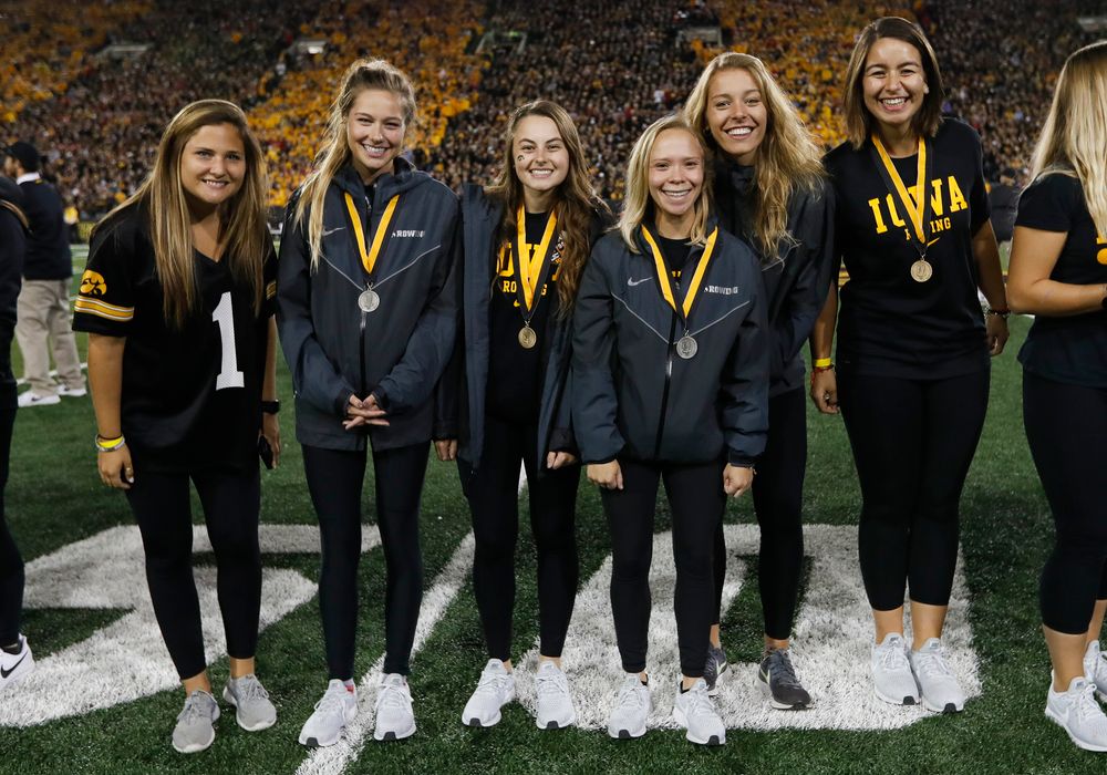 Members of the Iowa rowing team are recognized by the Presidential Committee on Athletics at halftime during a game against Wisconsin on September 22, 2018. (Tork Mason/hawkeyesports.com)