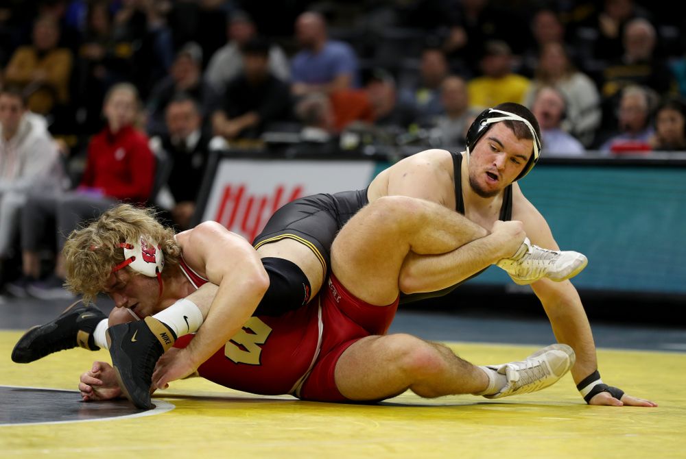 IowaÕs Tony Cassioppi wrestles WisconsinÕs Trent Hillger at heavyweight Sunday, December 1, 2019 at Carver-Hawkeye Arena. Cassioppi won the match 3-2. (Brian Ray/hawkeyesports.com)