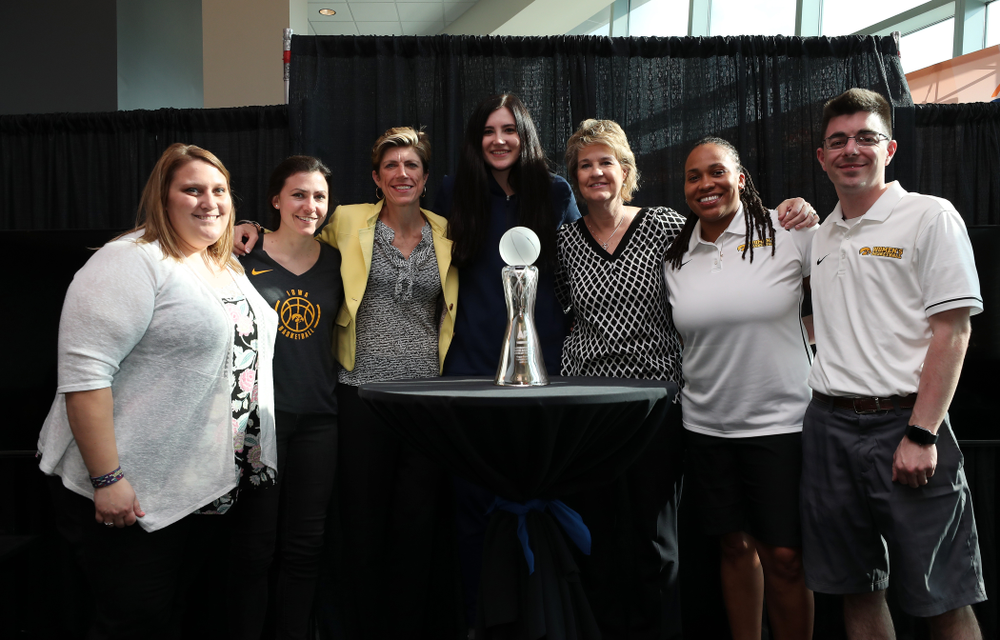 Iowa Hawkeyes forward Megan Gustafson (10) poses for photo with the Iowa Women's Basketball staff after winning the Associated Press Player Of The Year during a news conference Thursday, April 4, 2019 at Amalie Arena in Tampa, FL. (Brian Ray/hawkeyesports.com)