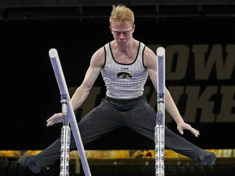 Iowa's Nick Merryman competes in the parallel bars during the second day of the Big Ten Men's Gymnastics Championships at Carver-Hawkeye Arena in Iowa City on Saturday, Apr. 6, 2019. (Stephen Mally/hawkeyesports.com)