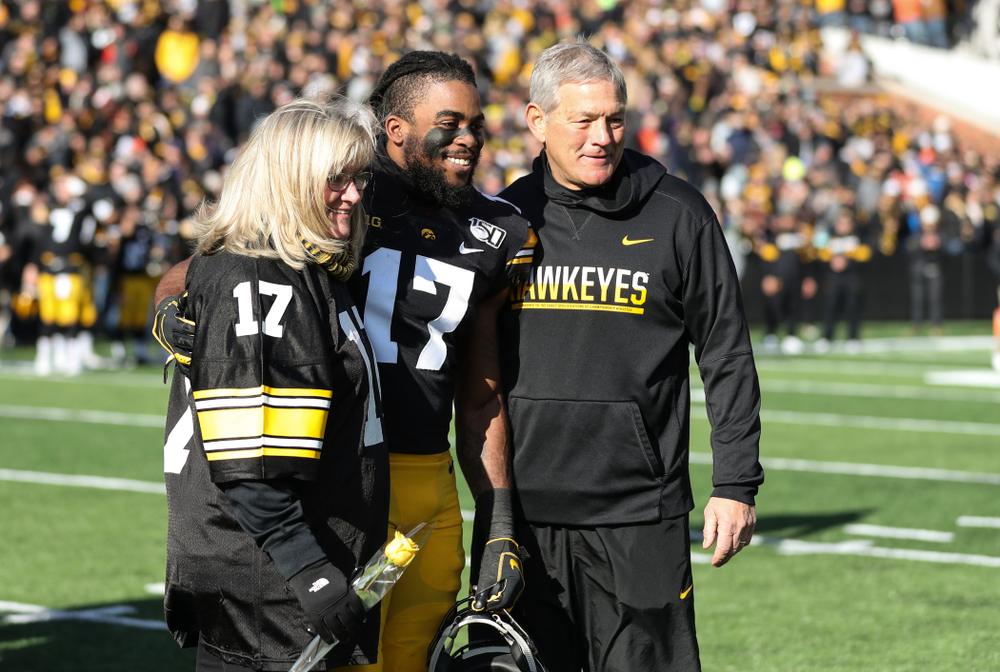 Iowa Hawkeyes defensive back Devonte Young (17) and Kirk and Mary Ferentz during Senior Day festivities before their game against the Illinois Fighting Illini Saturday, November 23, 2019 at Kinnick Stadium. (Brian Ray/hawkeyesports.com)