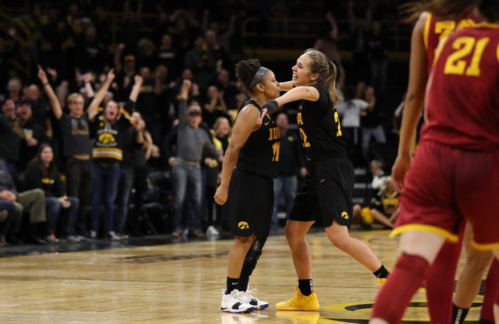Iowa Hawkeyes guard Tania Davis (11) celebrates with guard Kathleen Doyle (22) after making the game winning three point basket against the Iowa State Cyclones in the Iowa Corn Cy-Hawk Series Wednesday, December 5, 2018 at Carver-Hawkeye Arena. (Brian Ray/hawkeyesports.com)