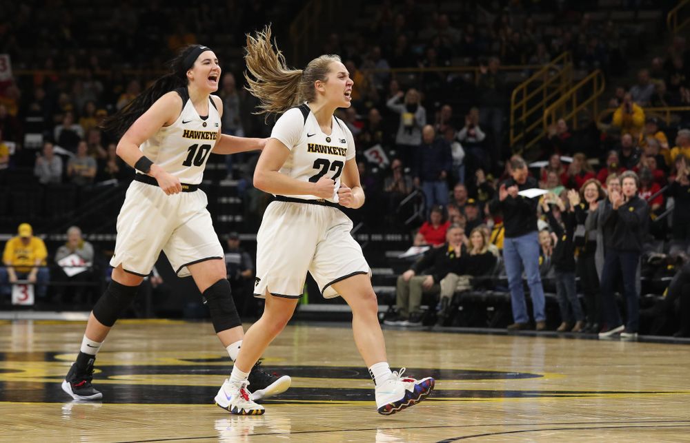 Iowa Hawkeyes guard Kathleen Doyle (22) and forward Megan Gustafson (10) react to an and one by forward Hannah Stewart (21) against the Purdue Boilermakers Sunday, January 27, 2019 at Carver-Hawkeye Arena. (Brian Ray/hawkeyesports.com)