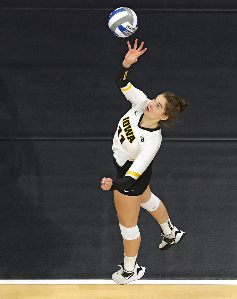 Iowa’s Blythe Rients (11) tips the ball over the net during the second set of their match at Carver-Hawkeye Arena in Iowa City on Saturday, Nov 30, 2019. (Stephen Mally/hawkeyesports.com)