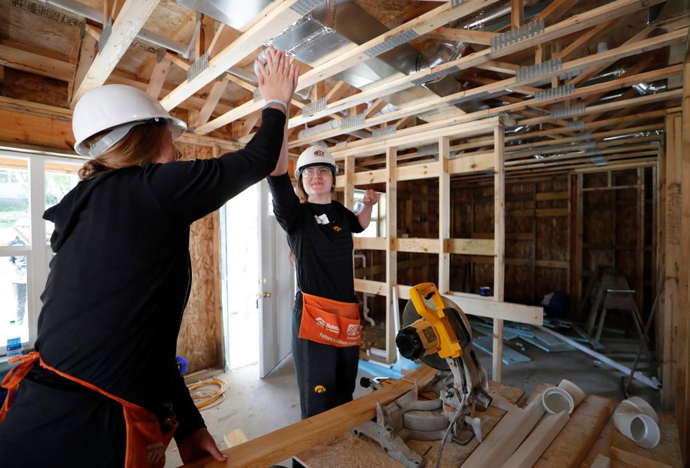 Iowa Hawkeyes forward Megan Gustafson (10) and Iowa Hawkeyes forward/center Monika Czinano (25) work on the Habitat for Humanity Women's Build Wednesday, September 26, 2018 in Iowa City. (Brian Ray/hawkeyesports.com)