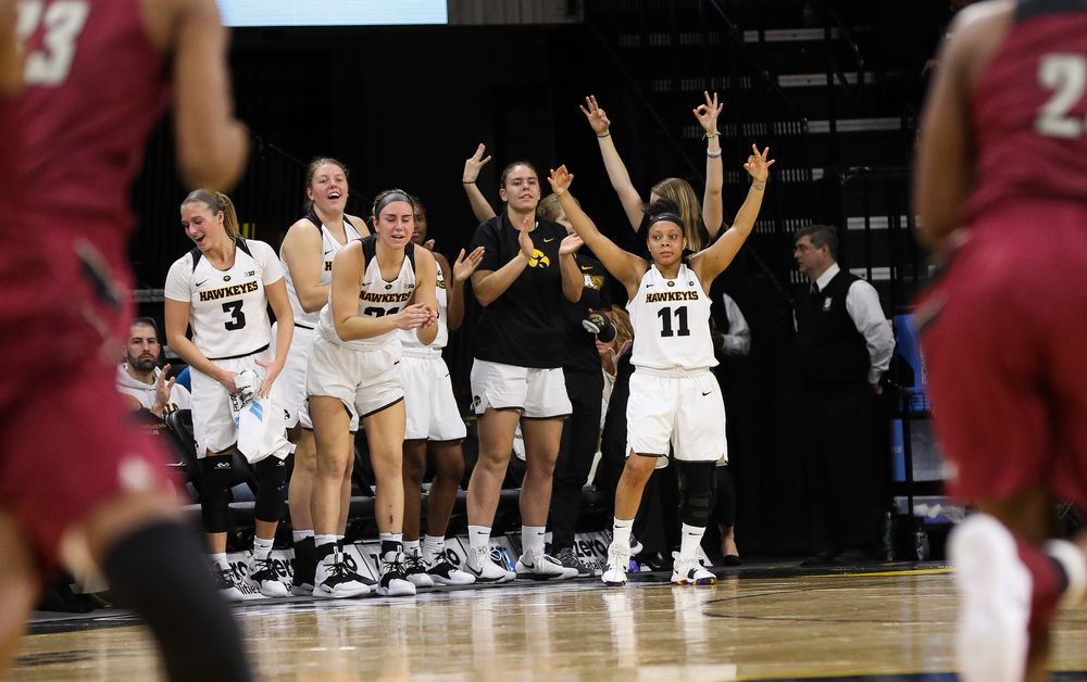 The Iowa Hawkeyes bench reacts to a made 3-pointer by Iowa Hawkeyes guard Zion Sanders (24) during a game against North Carolina Central at Carver-Hawkeye Arena on November 17, 2018. (Tork Mason/hawkeyesports.com)