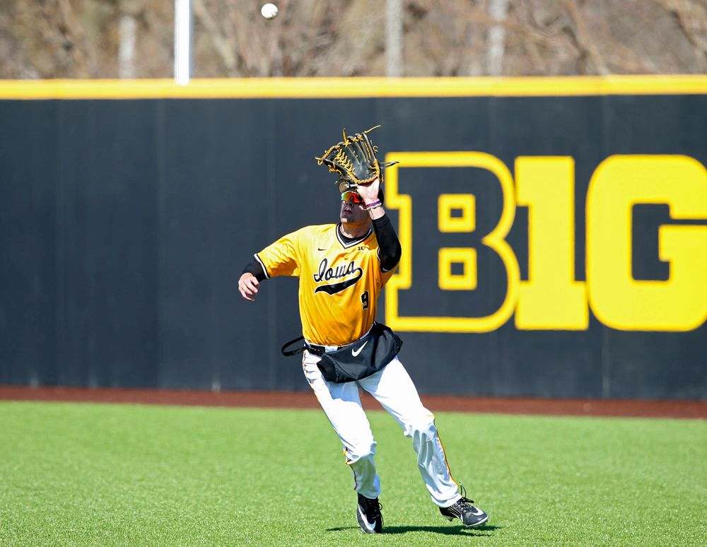 Iowa Hawkeyes right fielder Ben Norman (9) prepares to pull in a fly ball for an out on the front end of an inning ending double play during the eighth inning against Illinois at Duane Banks Field in Iowa City on Sunday, Mar. 31, 2019. (Stephen Mally/hawkeyesports.com)