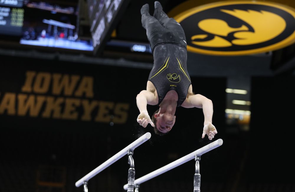 Iowa's Jake Brodarzon competes on the parallel bars against the Ohio State Buckeyes Saturday, March 16, 2019 at Carver-Hawkeye Arena. (Brian Ray/hawkeyesports.com)