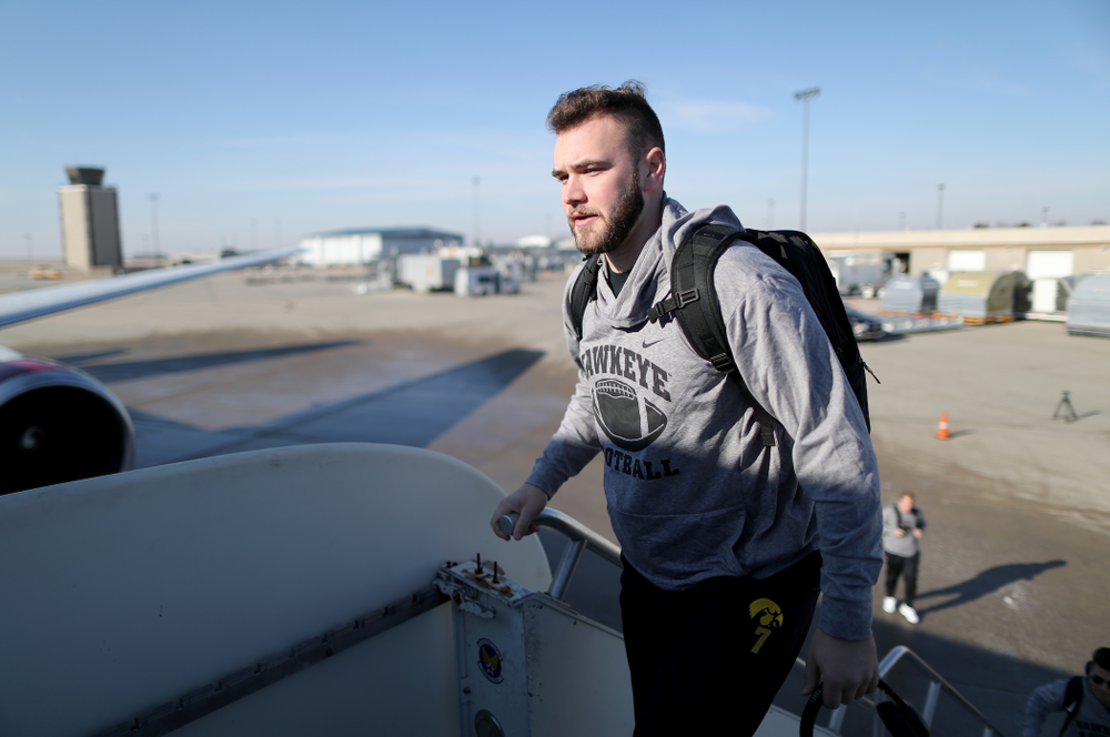 Iowa Hawkeyes punter Colten Rastetter (7) boards the team plane at the Eastern Iowa Airport Saturday, December 21, 2019 on the way to San Diego, CA for the Holiday Bowl. (Brian Ray/hawkeyesports.com)