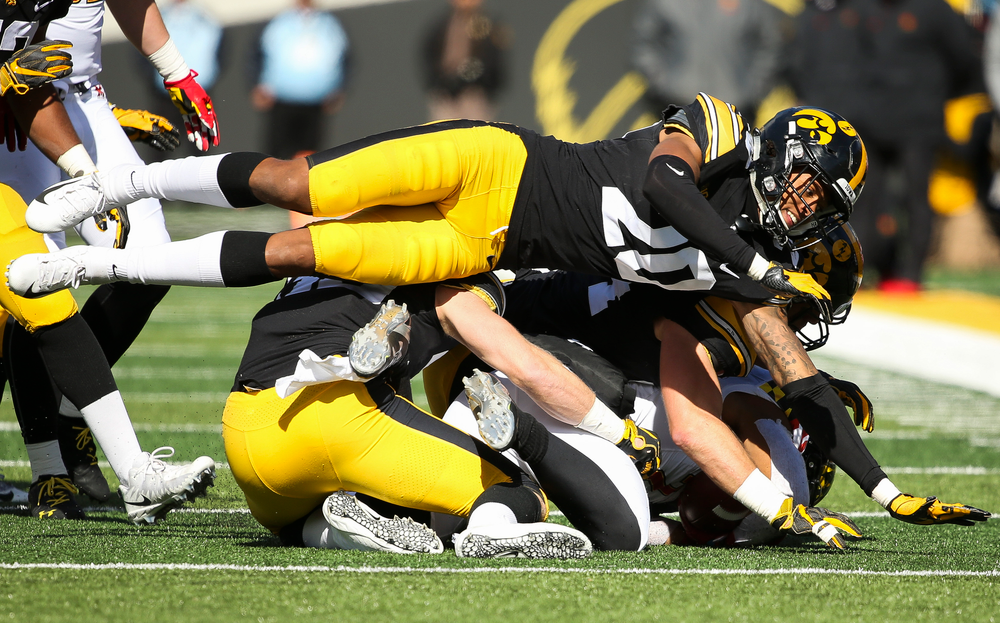 Iowa Hawkeyes defensive back Julius Brents (20) makes a tackle during a game against Maryland at Kinnick Stadium on October 20, 2018. (Tork Mason/hawkeyesports.com)