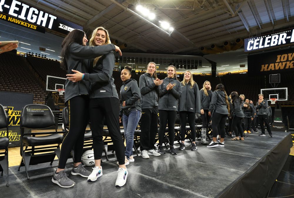 Iowa Hawkeyes forward Megan Gustafson (10) hugs forward Hannah Stewart (21) after finding out her jersey will be retired at a ceremony next season during the teamÕs Celebr-Eight event Wednesday, April 24, 2019 at Carver-Hawkeye Arena. (Brian Ray/hawkeyesports.com)