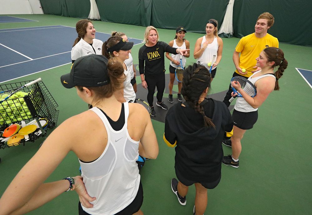 Iowa head coach Sasha Schmid talks to her team before their match at the Hawkeye Tennis and Recreation Complex in Iowa City on Sunday, February 23, 2020. (Stephen Mally/hawkeyesports.com)