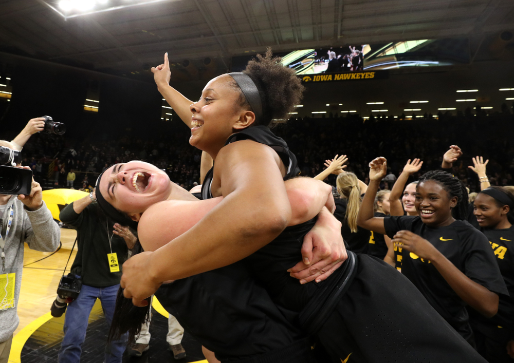 Iowa Hawkeyes forward Megan Gustafson (10) and guard Tania Davis (11) celebrate their 73-70 win against the Iowa State Cyclones in the Iowa Corn Cy-Hawk Series Wednesday, December 5, 2018 at Carver-Hawkeye Arena. (Brian Ray/hawkeyesports.com)
