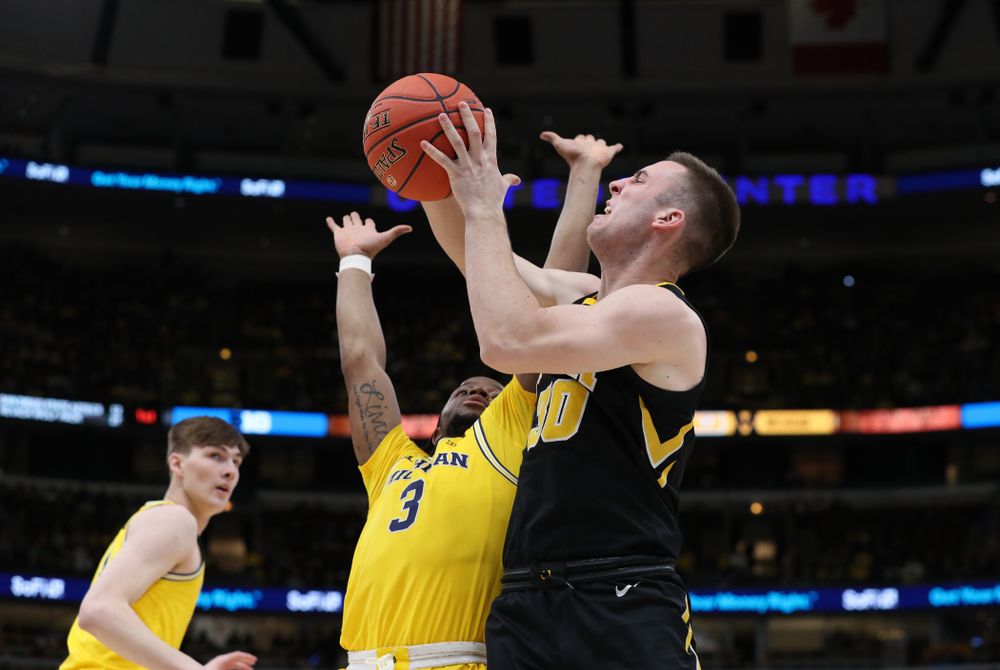Iowa Hawkeyes guard Connor McCaffery (30) against the Michigan Wolverines in the 2019 Big Ten Men's Basketball Tournament Friday, March 15, 2019 at the United Center in Chicago. (Brian Ray/hawkeyesports.com)