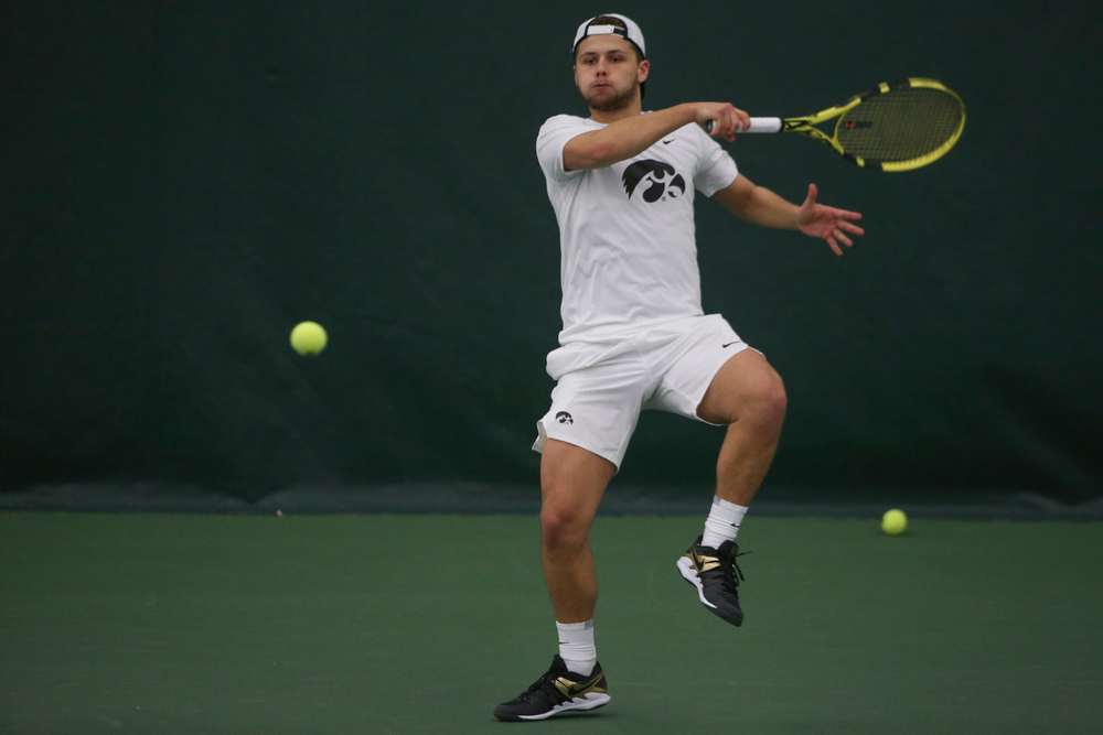 Iowa’s Will Davies returns a hit during the Iowa men’s tennis meet vs Nebraska on Sunday, March 1, 2020 at the Hawkeye Tennis and Recreation Complex. (Lily Smith/hawkeyesports.com)