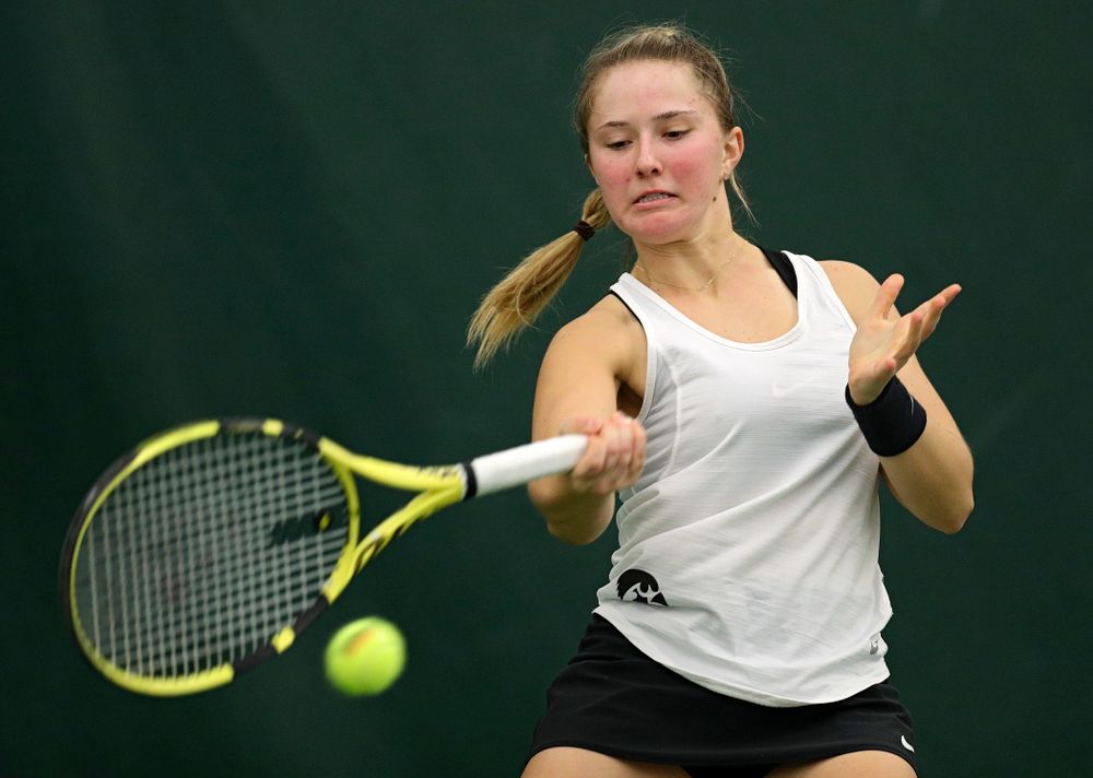 Iowa’s Danielle Burich returns a shot during her singles match at the Hawkeye Tennis and Recreation Complex in Iowa City on Sunday, February 23, 2020. (Stephen Mally/hawkeyesports.com)
