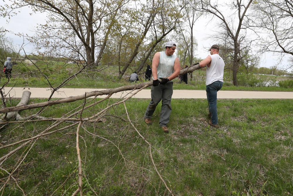 Members of the Hawkeye Football team volunteer with the Iowa City Public Works department along the Iowa River during the annual Iowa Athletics Day of Caring Sunday, April 28, 2019 in Iowa City. (Brian Ray/hawkeyesports.com)