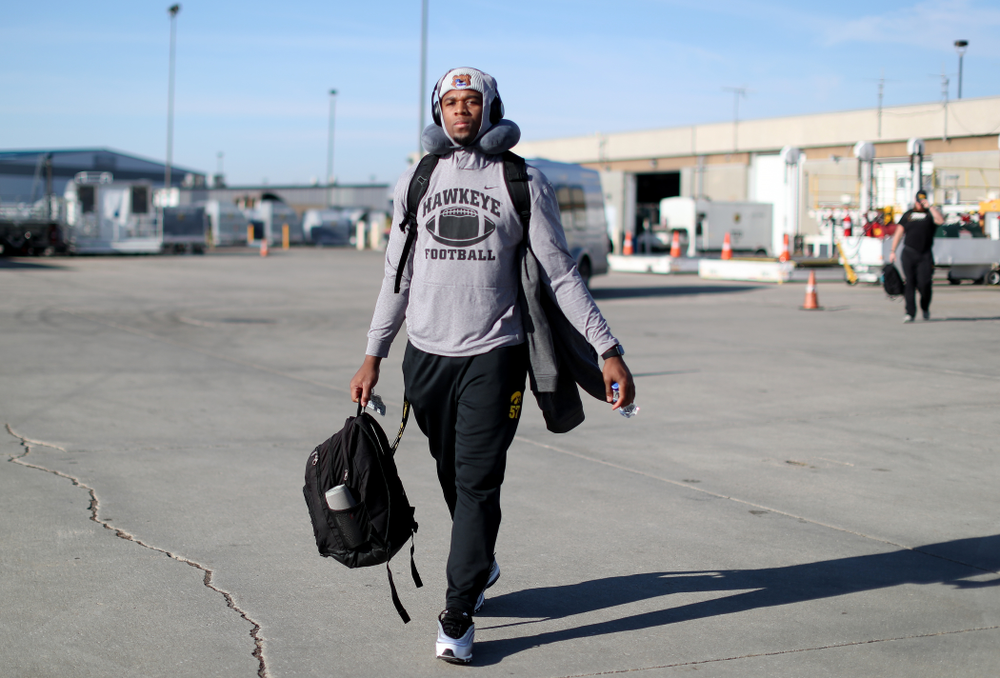 Iowa Hawkeyes defensive end Chauncey Golston (57) boards the team plane at the Eastern Iowa Airport Saturday, December 21, 2019 on the way to San Diego, CA for the Holiday Bowl. (Brian Ray/hawkeyesports.com)