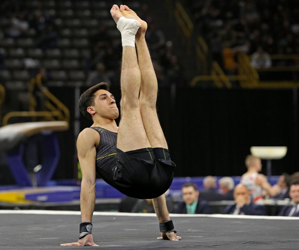 Iowa's Andrew Herrador competes in the floor during the first day of the Big Ten Men's Gymnastics Championships at Carver-Hawkeye Arena in Iowa City on Friday, Apr. 5, 2019. (Stephen Mally/hawkeyesports.com)