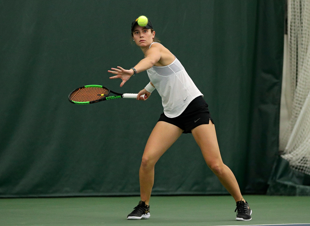 Iowa’s Elise Van Heuvelen returns a shot during her singles match at the Hawkeye Tennis and Recreation Complex in Iowa City on Sunday, February 23, 2020. (Stephen Mally/hawkeyesports.com)