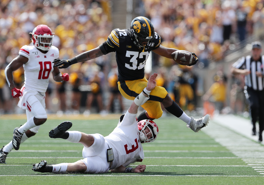 Iowa Hawkeyes linebacker Djimon Colbert (32) returns an interception against the Rutgers Scarlet Knights Saturday, September 7, 2019 at Kinnick Stadium. (Brian Ray/hawkeyesports.com)