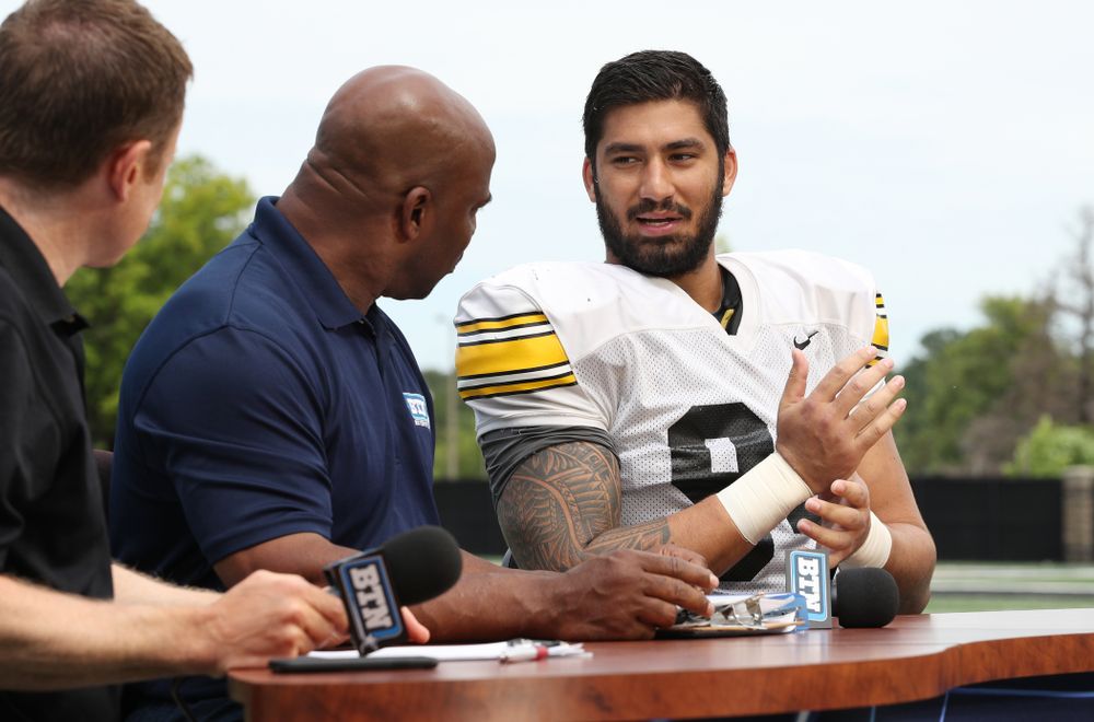 Iowa Hawkeyes defensive end A.J. Epenesa (94) and defensive back Michael Ojemudia (11) on the set of the BTN Tailgate Tour following fall camp Practice No. 16 Tuesday, August 20, 2019 at the Ronald D. and Margaret L. Kenyon Football Practice Facility. (Brian Ray/hawkeyesports.com)
