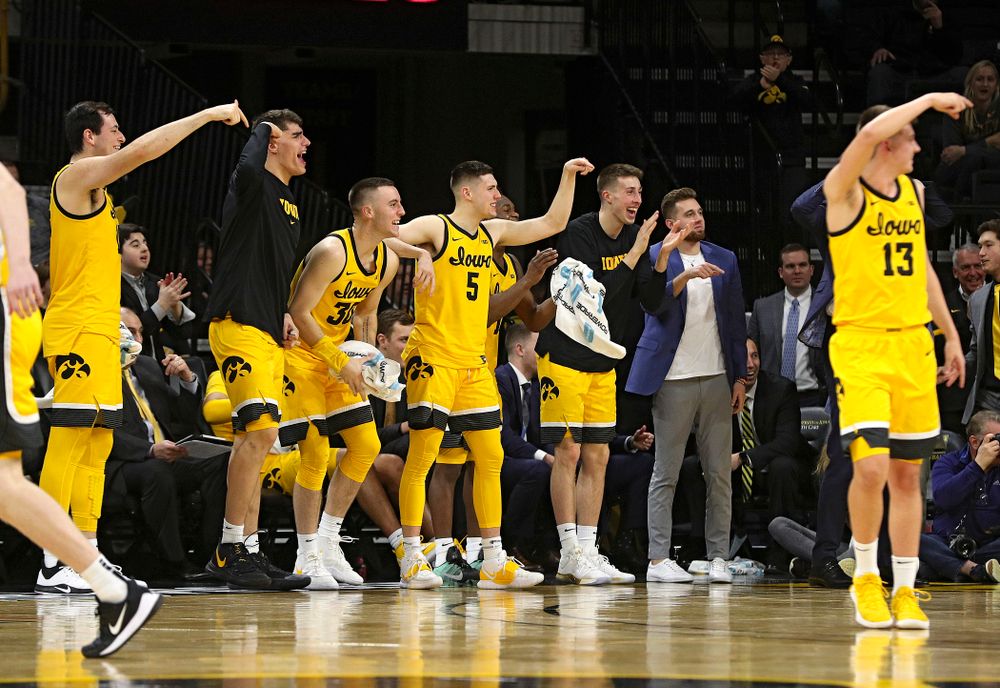 Iowa Hawkeyes forward Ryan Kriener (15), center Luka Garza (55), guard Connor McCaffery (30), guard CJ Fredrick (5), guard Joe Wieskamp (10), an guard Jordan Bohannon (3) celebrate a goaltending call on Nebraska Cornhuskers during the second half of their game at Carver-Hawkeye Arena in Iowa City on Saturday, February 8, 2020. (Stephen Mally/hawkeyesports.com)
