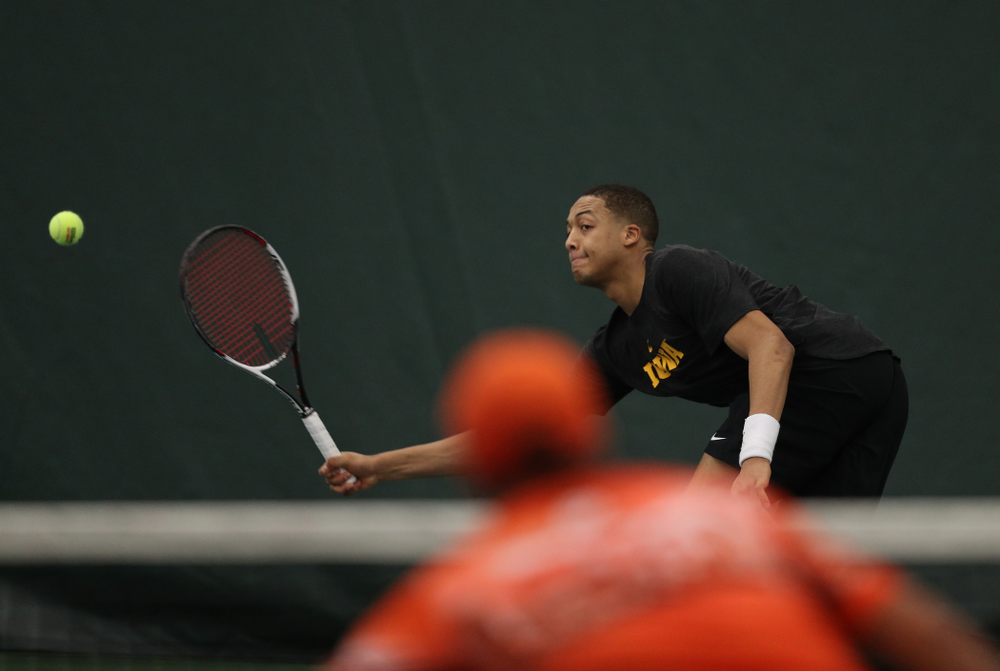 Oliver Okonkwo against the Miami Hurricanes Friday, February 8, 2019 at the Hawkeye Tennis and Recreation Complex. (Brian Ray/hawkeyesports.com)