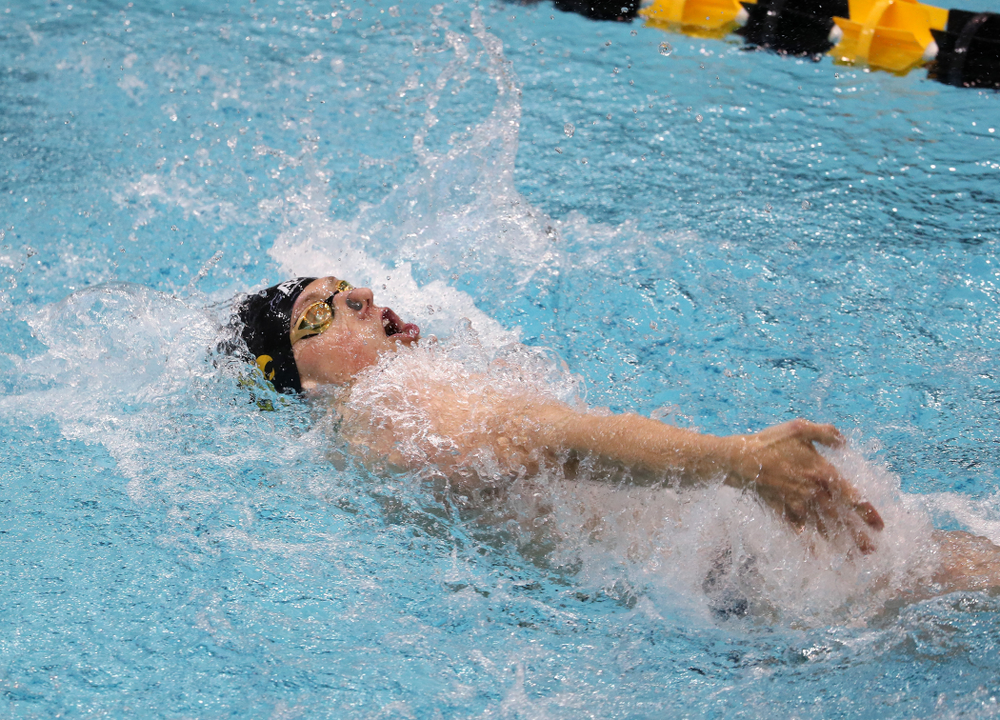 IowaÕs John Colin competes in the 100 yard backstroke against Notre Dame and Illinois Saturday, January 11, 2020 at the Campus Recreation and Wellness Center. (Brian Ray/hawkeyesports.com)