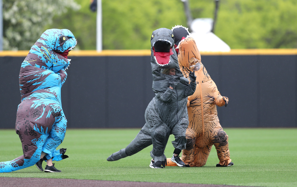 Rachel Heller, Susie Lund, and Emily run the dinosaur race during the Iowa Hawkeyes game against Michigan State Sunday, May 12, 2019 at Duane Banks Field. (Brian Ray/hawkeyesports.com)