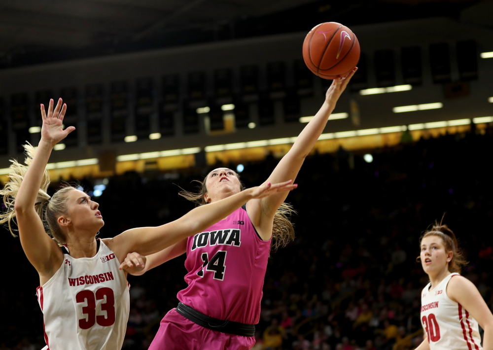 Iowa Hawkeyes forward McKenna Warnock (14) against the Wisconsin Badgers Sunday, February 16, 2020 at Carver-Hawkeye Arena. (Brian Ray/hawkeyesports.com)