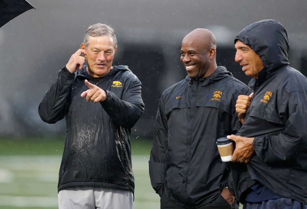 Iowa Hawkeyes head coach Kirk Ferentz talks with BTN's Gerry DiNardo, Howard Griffith, and Chuck Long during camp practice No. 15 Monday, August 20, 2018 at the Hansen Football Performance Center. (Brian Ray/hawkeyesports.com)