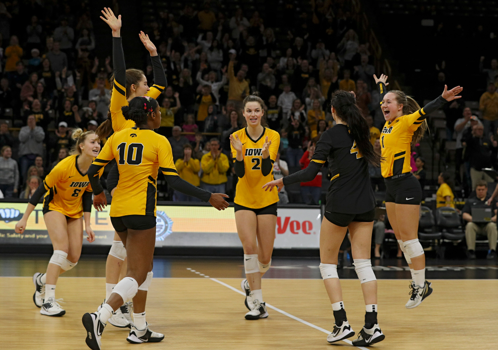 Iowa’s Kyndra Hansen (8), Blythe Rients (11), Griere Hughes (10), Courtney Buzzerio (2), Halle Johnston (4), and Joslyn Boyer (1) celebrate after winning the first set of their match at Carver-Hawkeye Arena in Iowa City on Friday, Nov 29, 2019. (Stephen Mally/hawkeyesports.com)