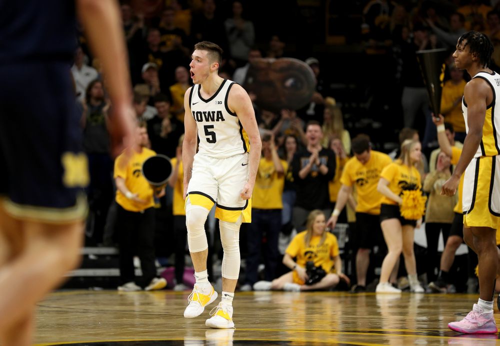 Iowa Hawkeyes guard CJ Fredrick (5) celebrates a three point basket against the Michigan Wolverines Friday, January 17, 2020 at Carver-Hawkeye Arena. (Brian Ray/hawkeyesports.com)
