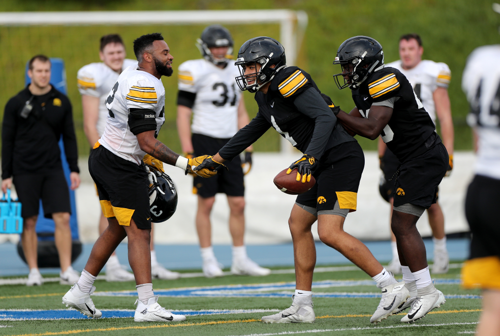 Iowa Hawkeyes linebacker Djimon Colbert (32) and wide receiver Desmond Hutson (81) during Holiday Bowl Practice No. 3 Tuesday, December 24, 2019 at San Diego Mesa College. (Brian Ray/hawkeyesports.com)