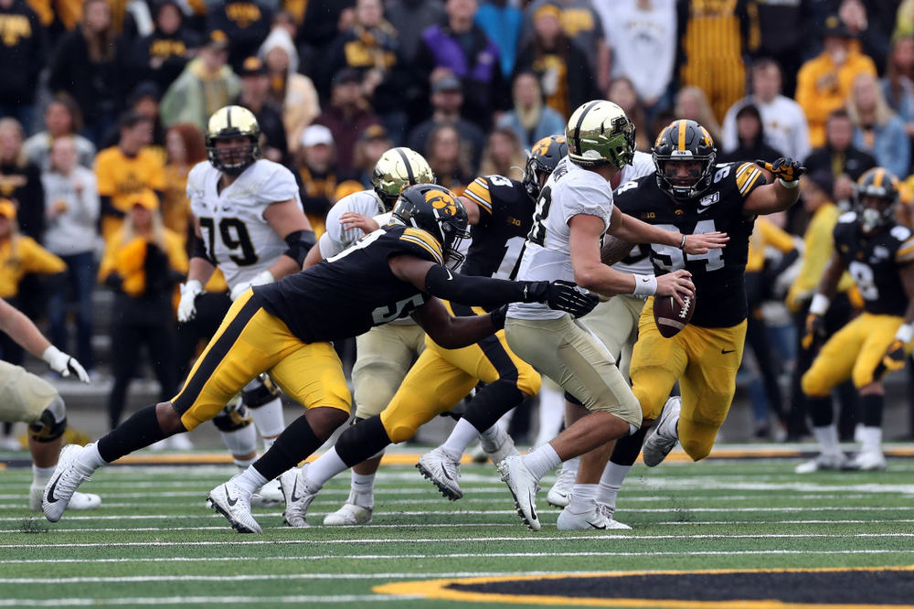 Iowa Hawkeyes defensive end Chauncey Golston (57) and defensive end A.J. Epenesa (94) against the Purdue Boilermakers Saturday, October 19, 2019 at Kinnick Stadium. (Brian Ray/hawkeyesports.com)