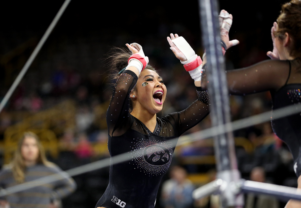 Iowa’s Clair Kaji competes on the bars against Michigan Friday, February 14, 2020 at Carver-Hawkeye Arena. (Brian Ray/hawkeyesports.com)