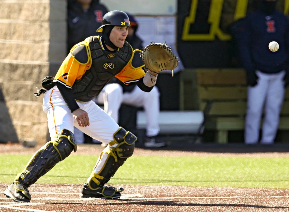 Iowa Hawkeyes catcher Austin Martin (34) pulls in a throw at the plate in the middle of an inning ending double play during the eighth inning against Illinois at Duane Banks Field in Iowa City on Sunday, Mar. 31, 2019. (Stephen Mally/hawkeyesports.com)