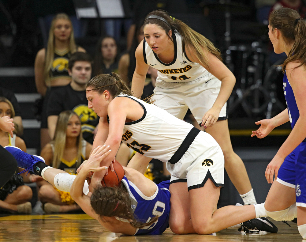 Iowa Hawkeyes forward Amanda Ollinger (43) hangs on to a tie ball during the third quarter of their game at Carver-Hawkeye Arena in Iowa City on Saturday, December 21, 2019. (Stephen Mally/hawkeyesports.com)
