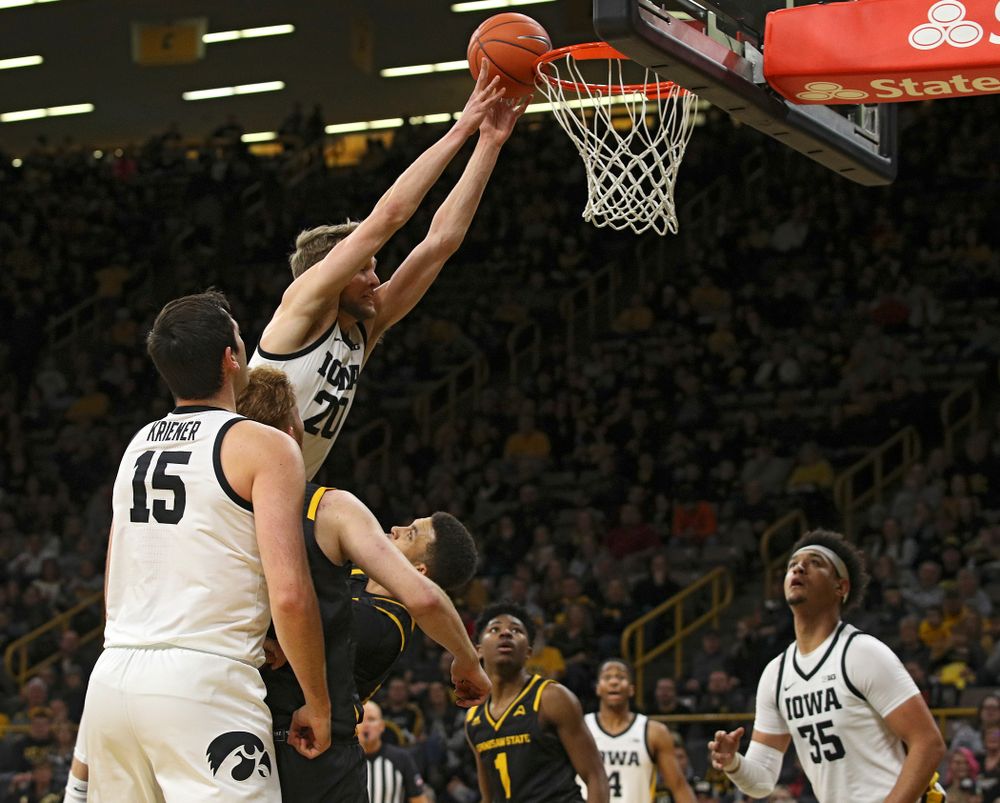 Iowa Hawkeyes forward Riley Till (20) is fouled as he tries to dunk over Kennesaw State Owls forward Bryson Lockley (24) during the second half of their their game at Carver-Hawkeye Arena in Iowa City on Sunday, December 29, 2019. (Stephen Mally/hawkeyesports.com)