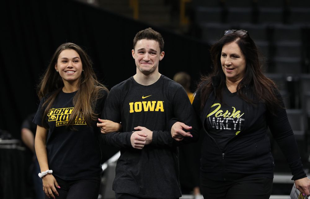 Iowa Men's Gymnast Jake Brodarzon and his family during senior day ceremonies following their meet against the Ohio State Buckeyes Saturday, March 16, 2019 at Carver-Hawkeye Arena. (Brian Ray/hawkeyesports.com)