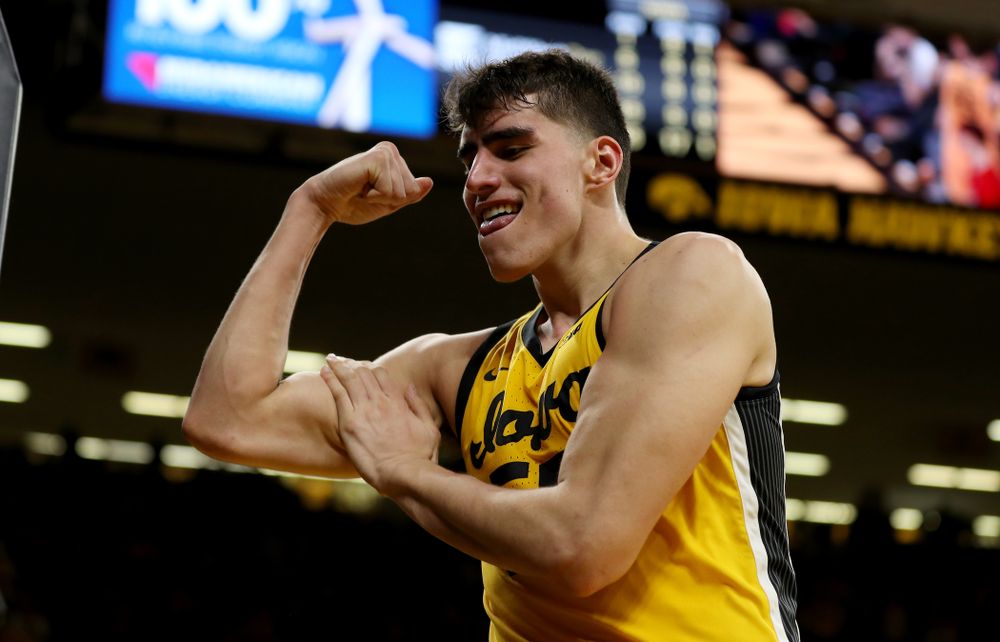Iowa Hawkeyes forward Luka Garza (55) flexes after making a basket and drawing a foul against the Rutgers Scarlet Knights Wednesday, January 22, 2020 at Carver-Hawkeye Arena. (Brian Ray/hawkeyesports.com)