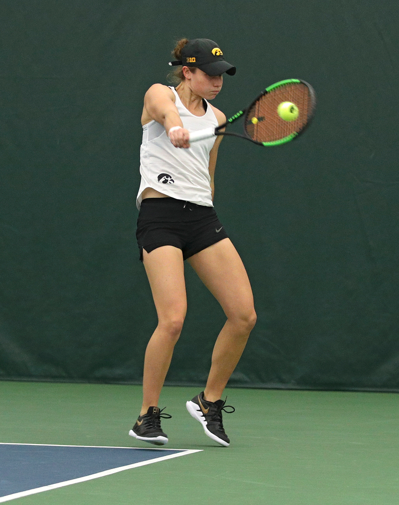 Iowa’s Elise Van Heuvelen returns a shot during her doubles match at the Hawkeye Tennis and Recreation Complex in Iowa City on Sunday, February 23, 2020. (Stephen Mally/hawkeyesports.com)
