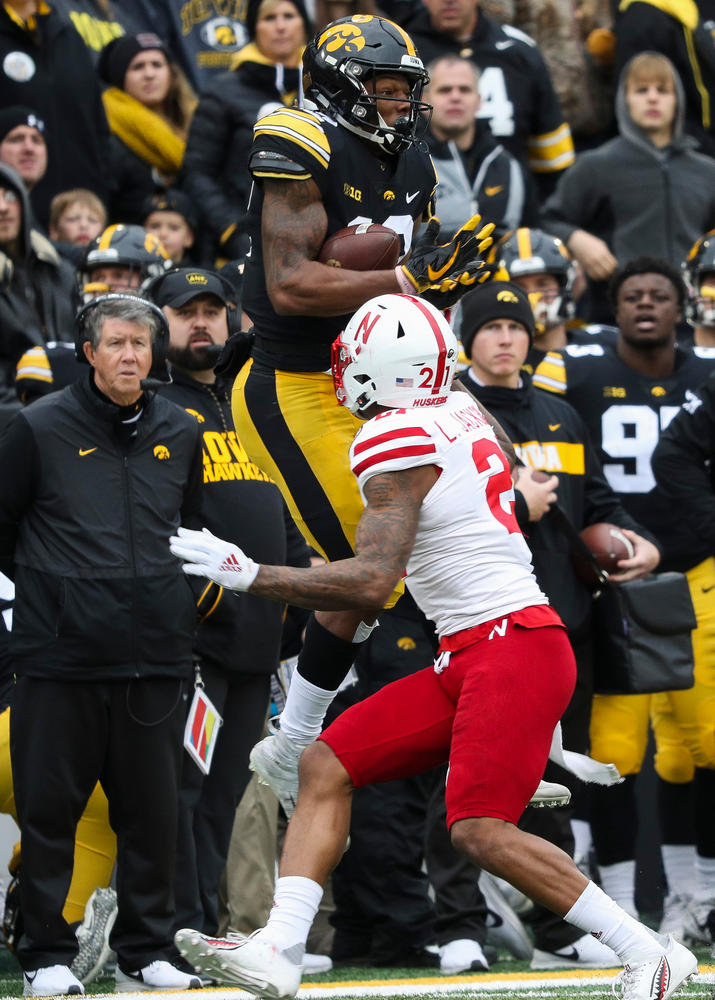 Iowa Hawkeyes wide receiver Brandon Smith (12) makes a first down reception during a game against Nebraska at Kinnick Stadium on November 23, 2018. (Tork Mason/hawkeyesports.com)