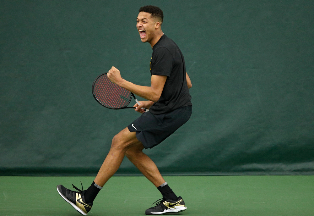 Iowa’s Oliver Okonkwo celebrates a point during their match at the Hawkeye Tennis and Recreation Complex in Iowa City on Thursday, January 16, 2020. (Stephen Mally/hawkeyesports.com)