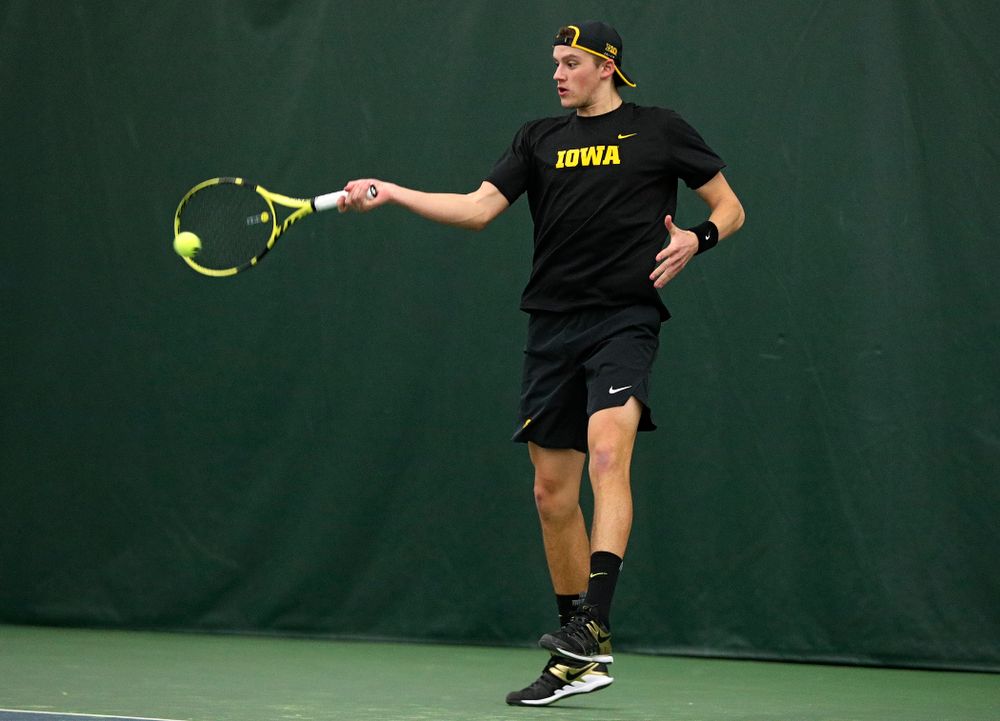 Iowa’s Joe Tyler returns a shot during his singles match at the Hawkeye Tennis and Recreation Complex in Iowa City on Friday, March 6, 2020. (Stephen Mally/hawkeyesports.com)