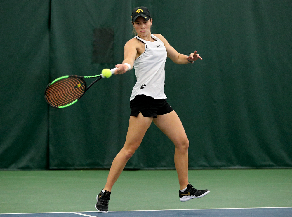 Iowa’s Elise Van Heuvelen returns a shot during her doubles match at the Hawkeye Tennis and Recreation Complex in Iowa City on Sunday, February 16, 2020. (Stephen Mally/hawkeyesports.com)